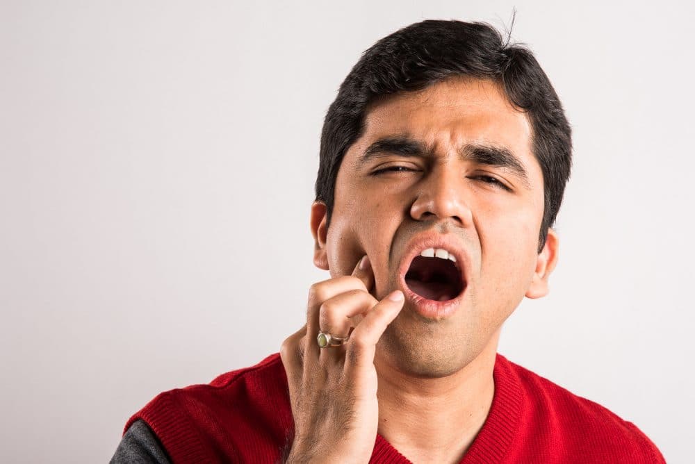 Young-man-suffers-from-tooth